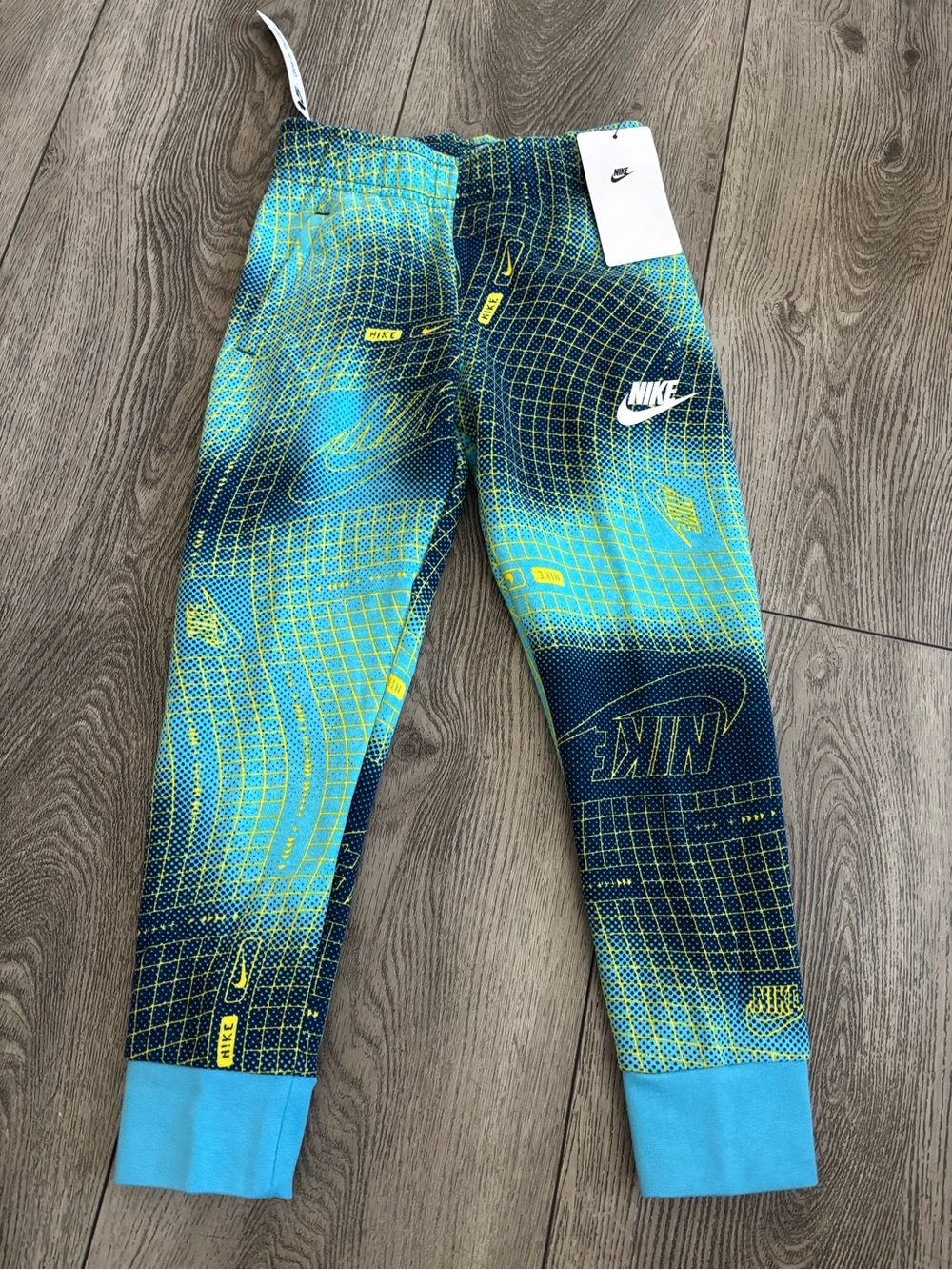 Nike Blue and Teal Graphic Kids pants with Yellow Accents glow in the dark